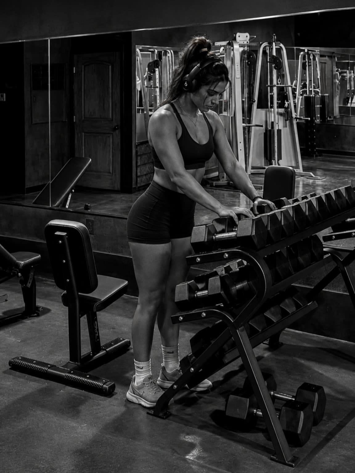 Southern Iron Fitness strength floor with benches, mirrors, and free weights